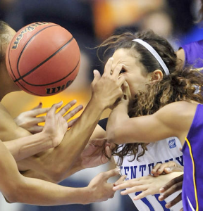 A scramble for a loose ball leads to a poke in the eye — just one example of an eye injury that can occur as a result of playing sports.  (Photo credit: Baltimore Sun)