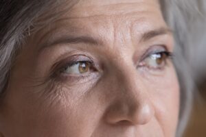 Upper,Face,Of,Serious,Senior,Woman,Looking,Away.,Brown,Eyes