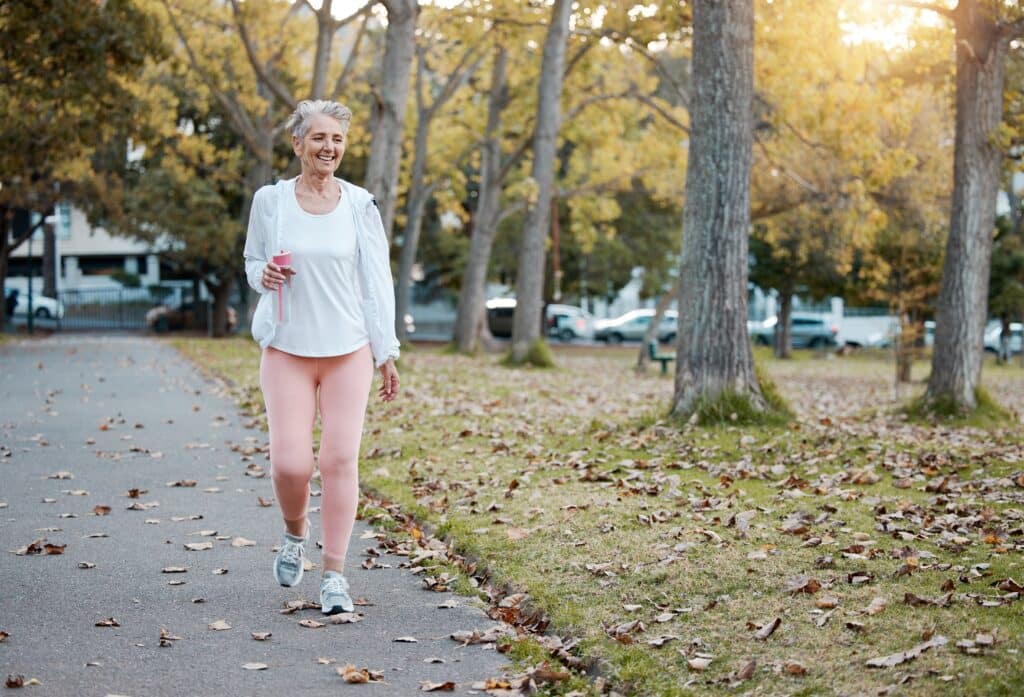 Older woman walking down a sidewalk after cataract surgery in Santa Rosa, CA