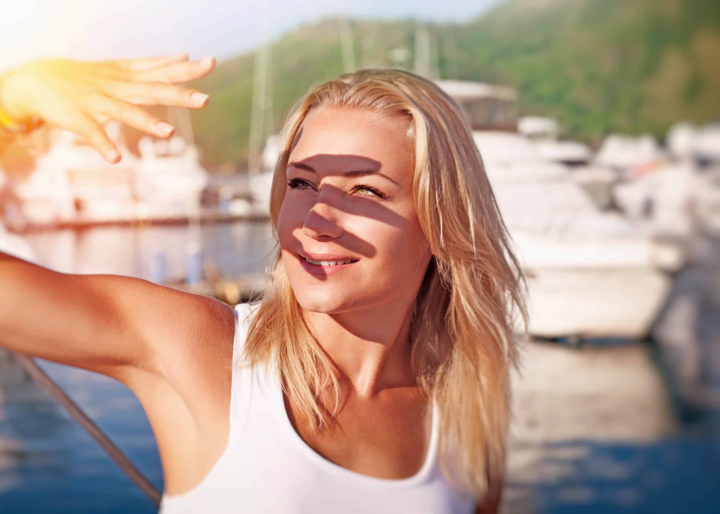 Woman shielding her eyes from the sun