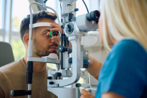 Man having an eye exam before corneal treatment.